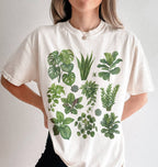 Person wearing a Botanical plant illustration shirt with green houseplants, perfect gardener gift for plant lovers and nature fans on a white background 