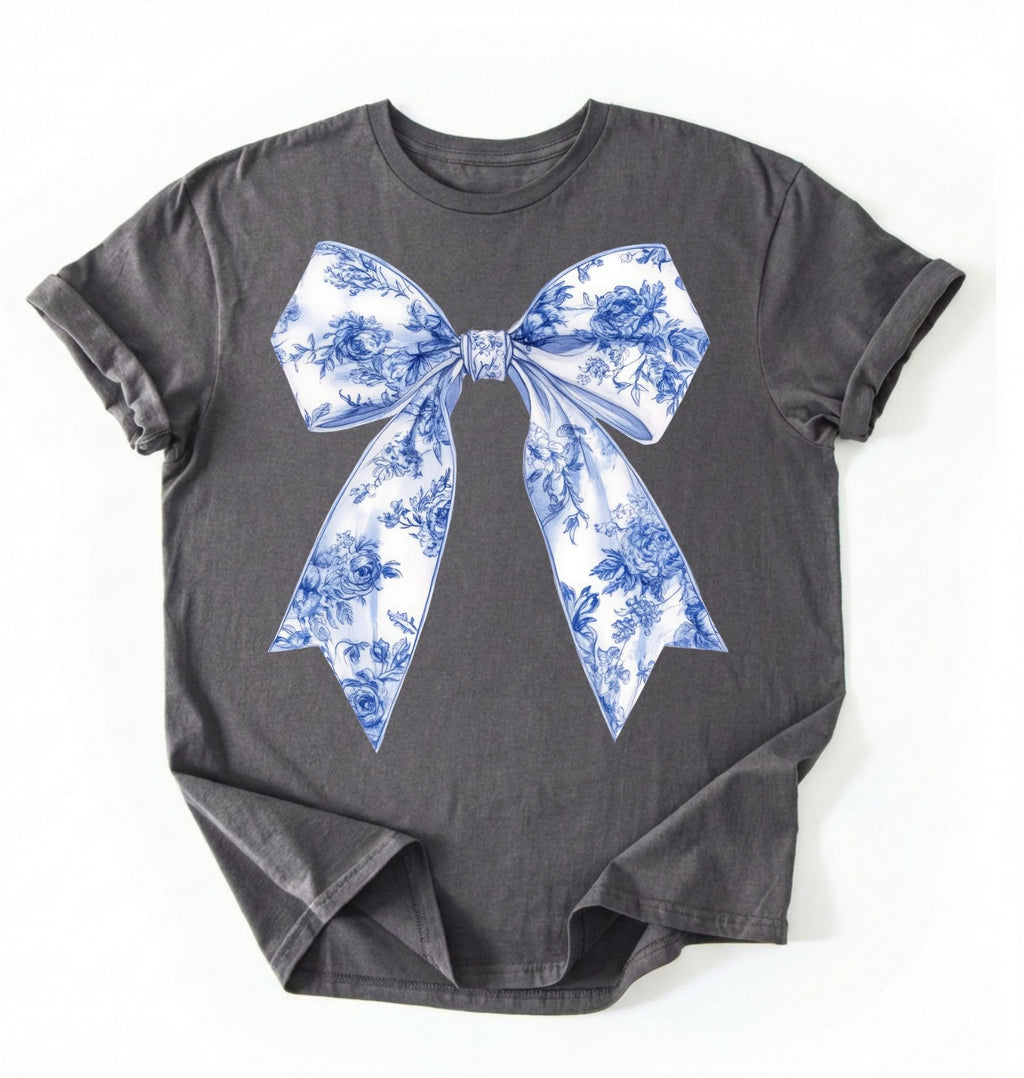 Pepper t-shirt with a white and blue floral bow graphic in a coquette cottagecore aesthetic, perfect as a stylish gift