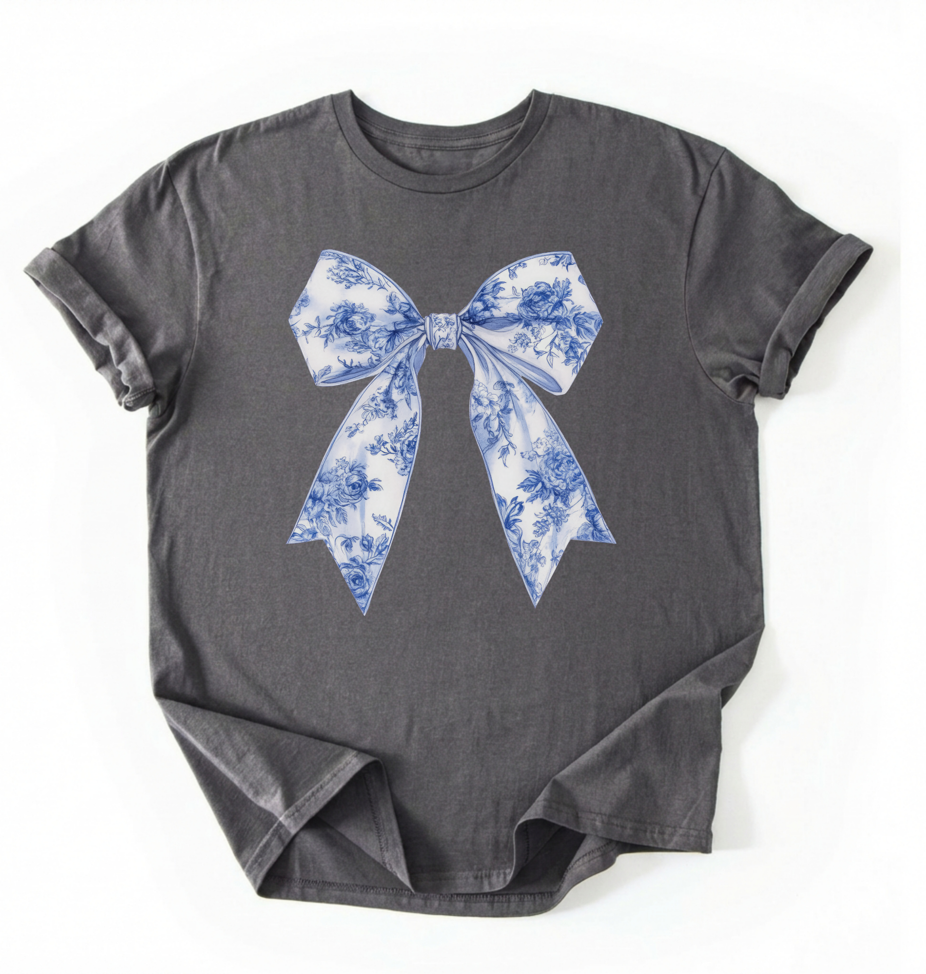 A charcoal heather t-shirt featuring a blue and white toile-patterned bow graphic printed on the chest, laid flat against a white background.