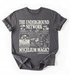 Flat lay of a Charcoal t-shirt featuring Mycelium network mushroom and root network illustrations with text reading “The Underground Network Mycelium Magic” with forest fungi design perfect gift for mushroom lovers nature fans and cottagecore style on a white background 