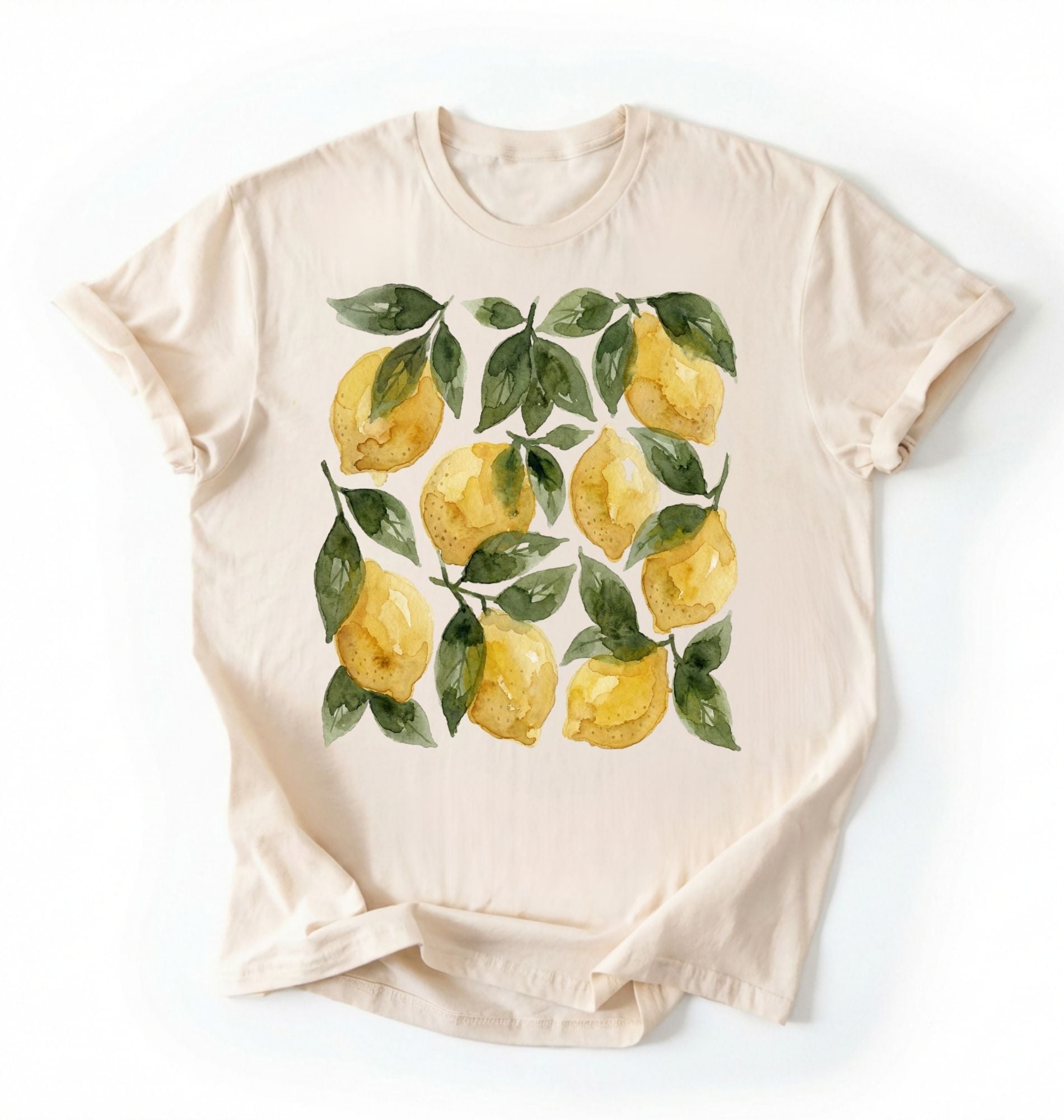Flat lay Natural t-shirt with watercolor lemon and green leaf pattern, cottagecore style gardener gift tee on a white background