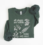 Flat lay of a forest green Funny plant lover sweatshirt some only once quote botanical illustration on a white background 