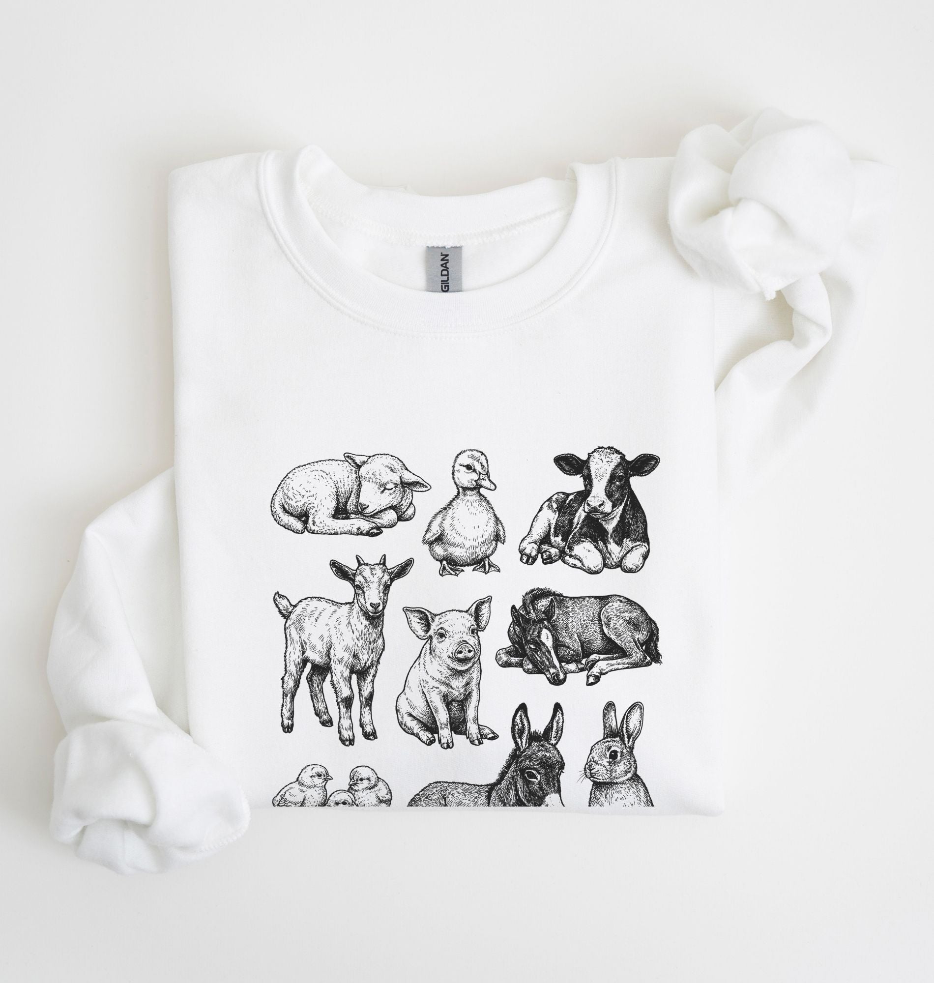 white sweatshirt with vintage baby farm animal illustrations in black ink, cozy cottagecore farm gift