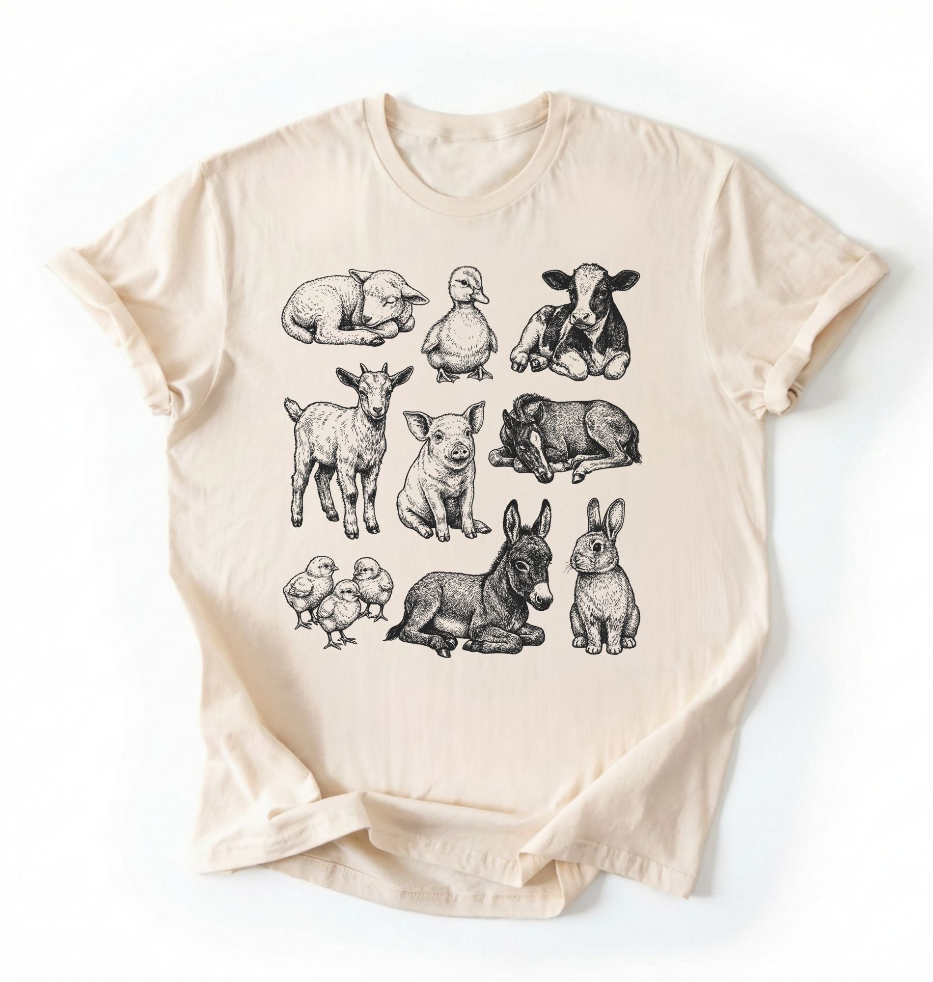 Flat lay of a Natural ivory Baby farm animals t-shirt with illustrated lamb, calf, piglet, duckling, chick, donkey, goat, and bunny on a white background