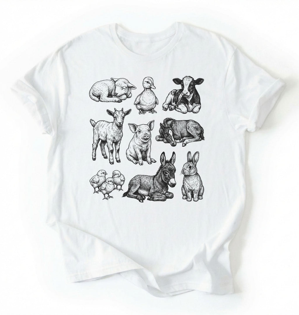 Flat lay of a white Baby farm animals t-shirt with illustrated lamb, calf, piglet, duckling, chick, donkey, goat, and bunny on a white background