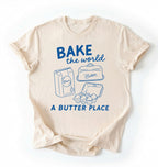 Flat lay of a Funny baking pun shirt with flour butter and eggs illustration on cream tee on a white background 