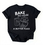 Flat lay of a Funny baking pun shirt with flour butter and eggs illustration on black tee on a white background 