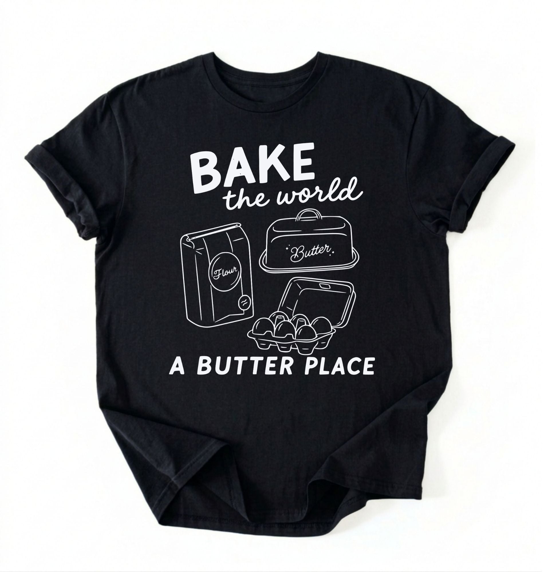 Flat lay of a Funny baking pun shirt with flour butter and eggs illustration on black tee on a white background 