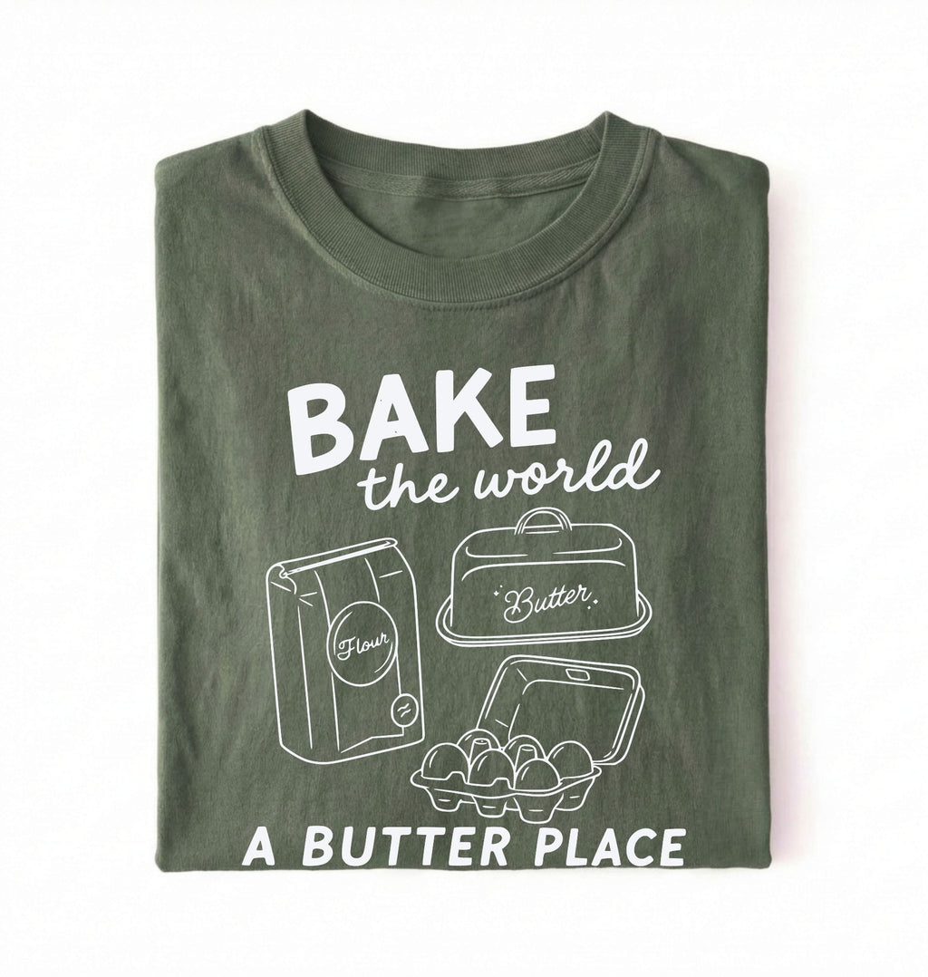 Flat lay of a Funny baking pun shirt with flour butter and eggs illustration on green tee on a white background 