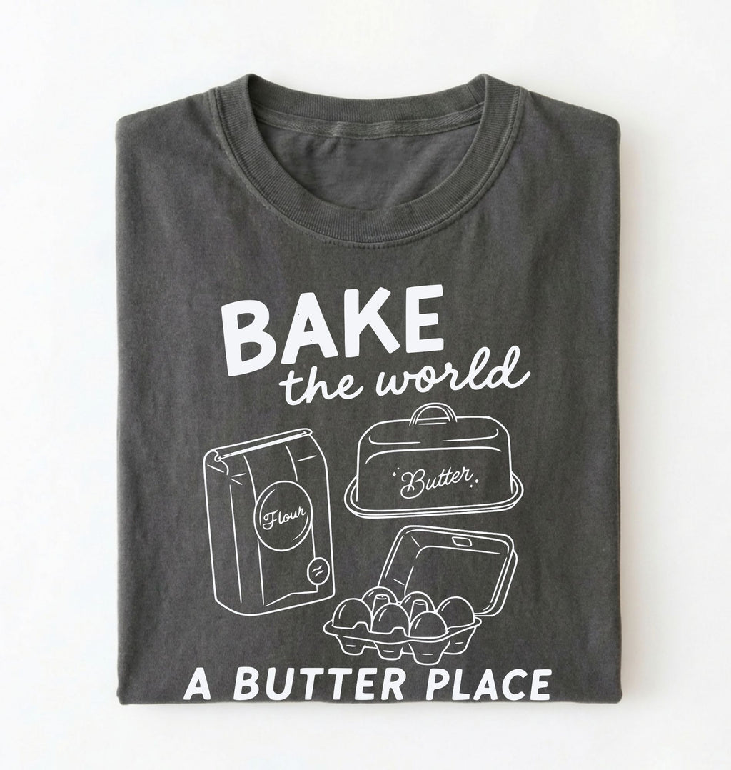 Flat lay of a Funny baking pun shirt with flour butter and eggs illustration on pepper tee on a white background 