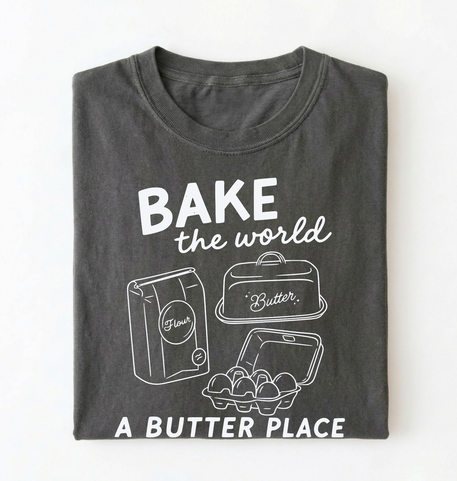 Flat lay of a Funny baking pun shirt with flour butter and eggs illustration on pepper tee on a white background 