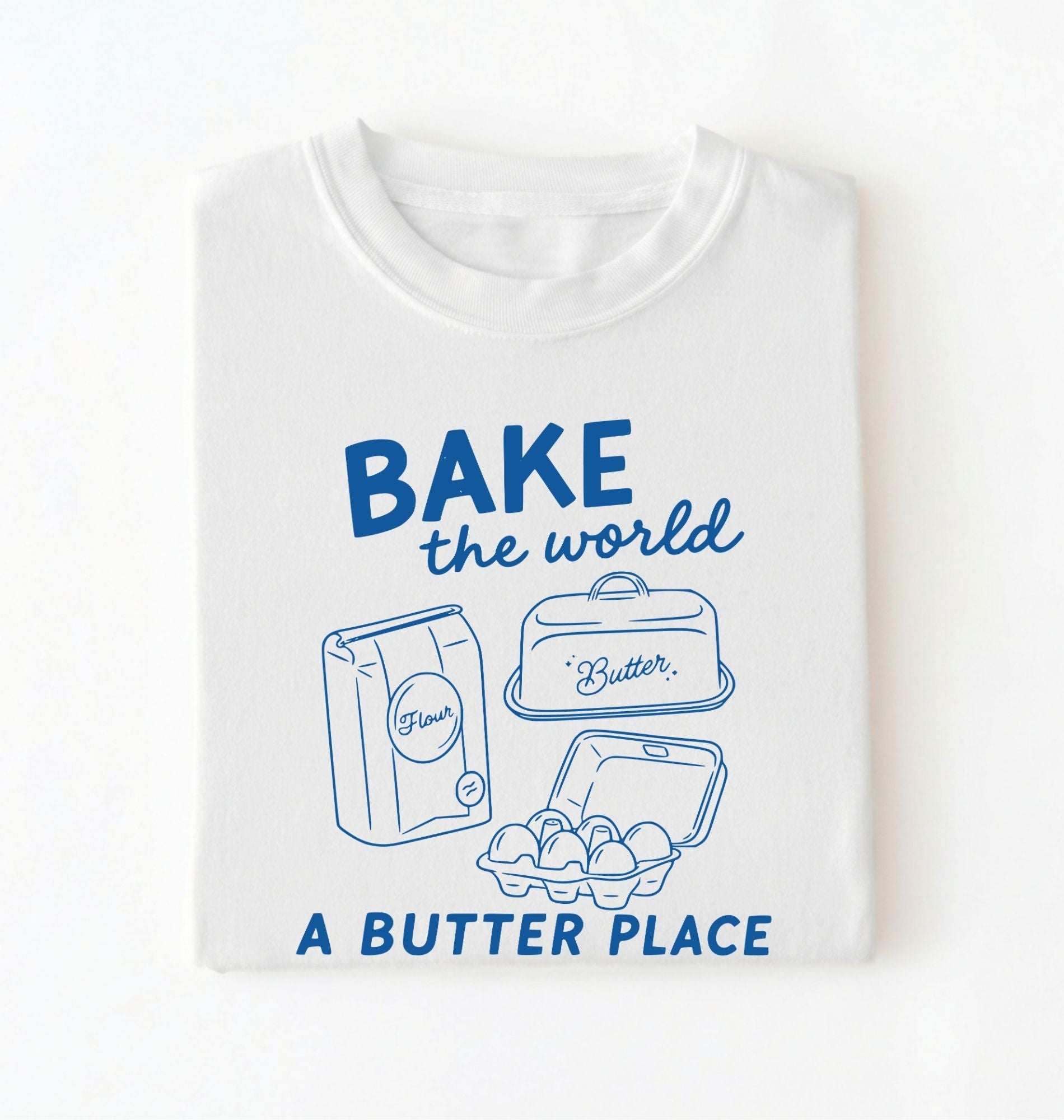 Flat lay of a Funny baking pun shirt with flour butter and eggs illustration on white tee on a white background 