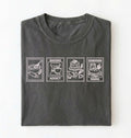 Flat lay of a gray Baking Addict Sourdough Mama graphic shirt with vintage baking stamp design for bread bakers on a white background 