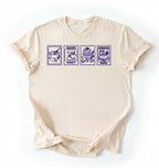 Flat lay of a cream Baking Addict Sourdough Mama graphic shirt with vintage baking stamp design for bread bakers on a white background 