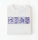 Flat lay of a white Baking Addict Sourdough Mama graphic shirt with vintage baking stamp design for bread bakers on a white background 
