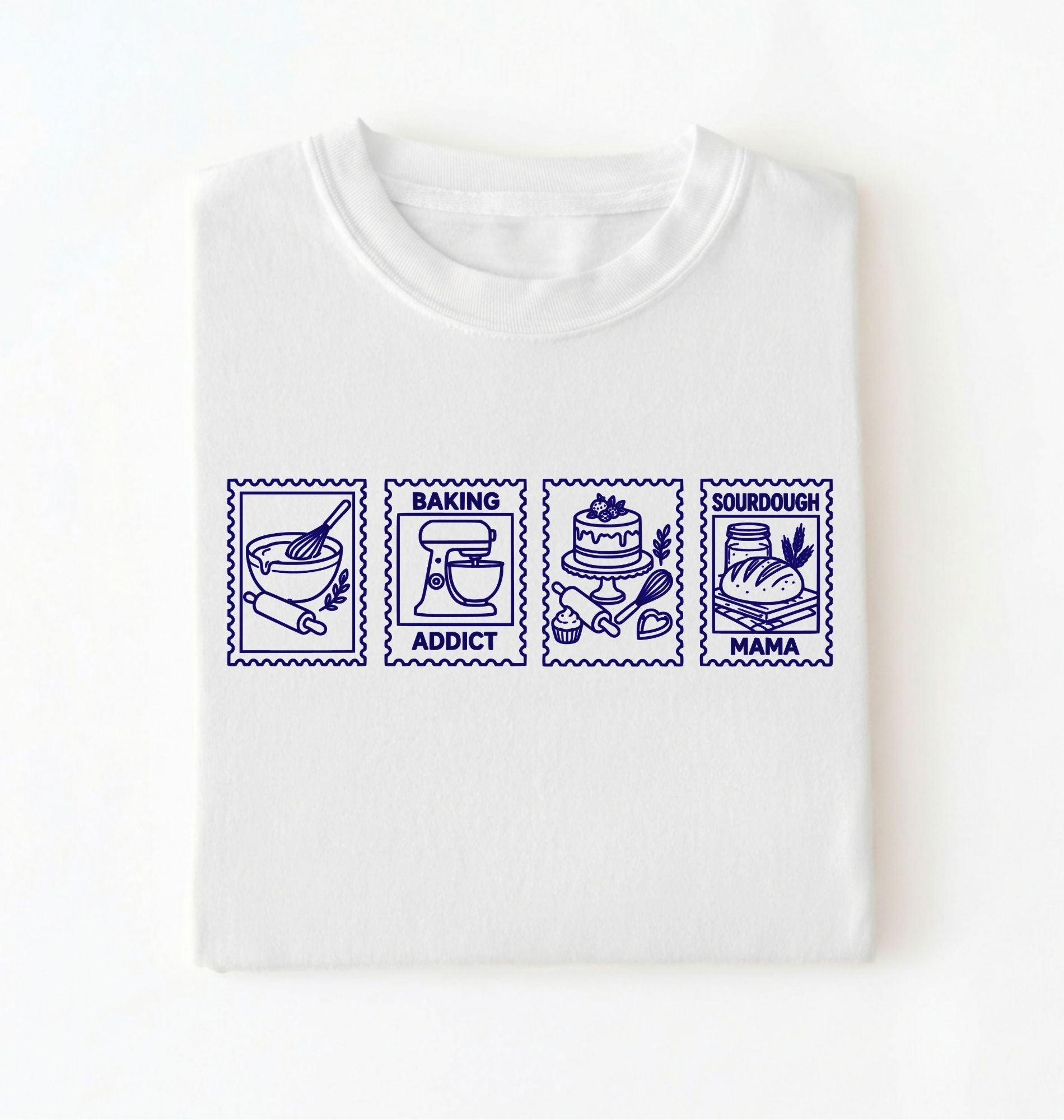 Flat lay of a white Baking Addict Sourdough Mama graphic shirt with vintage baking stamp design for bread bakers on a white background 