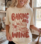 Person wearing a t-shirt with 'Baking and Wine' design in a kitchen setting