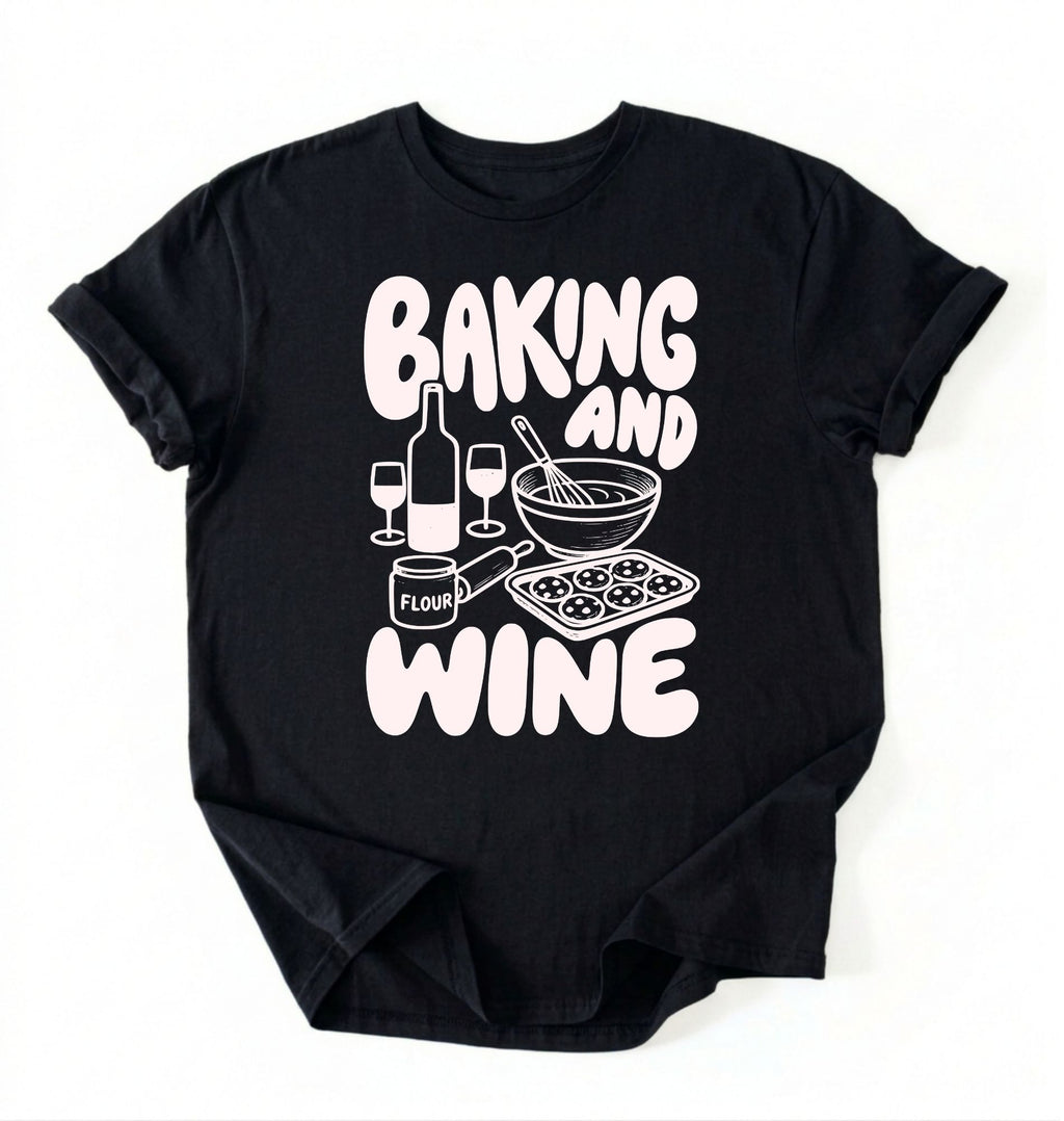 Flat lay of a black Baking and Wine graphic shirt for home bakers featuring baking tools and wine themed design on a white background