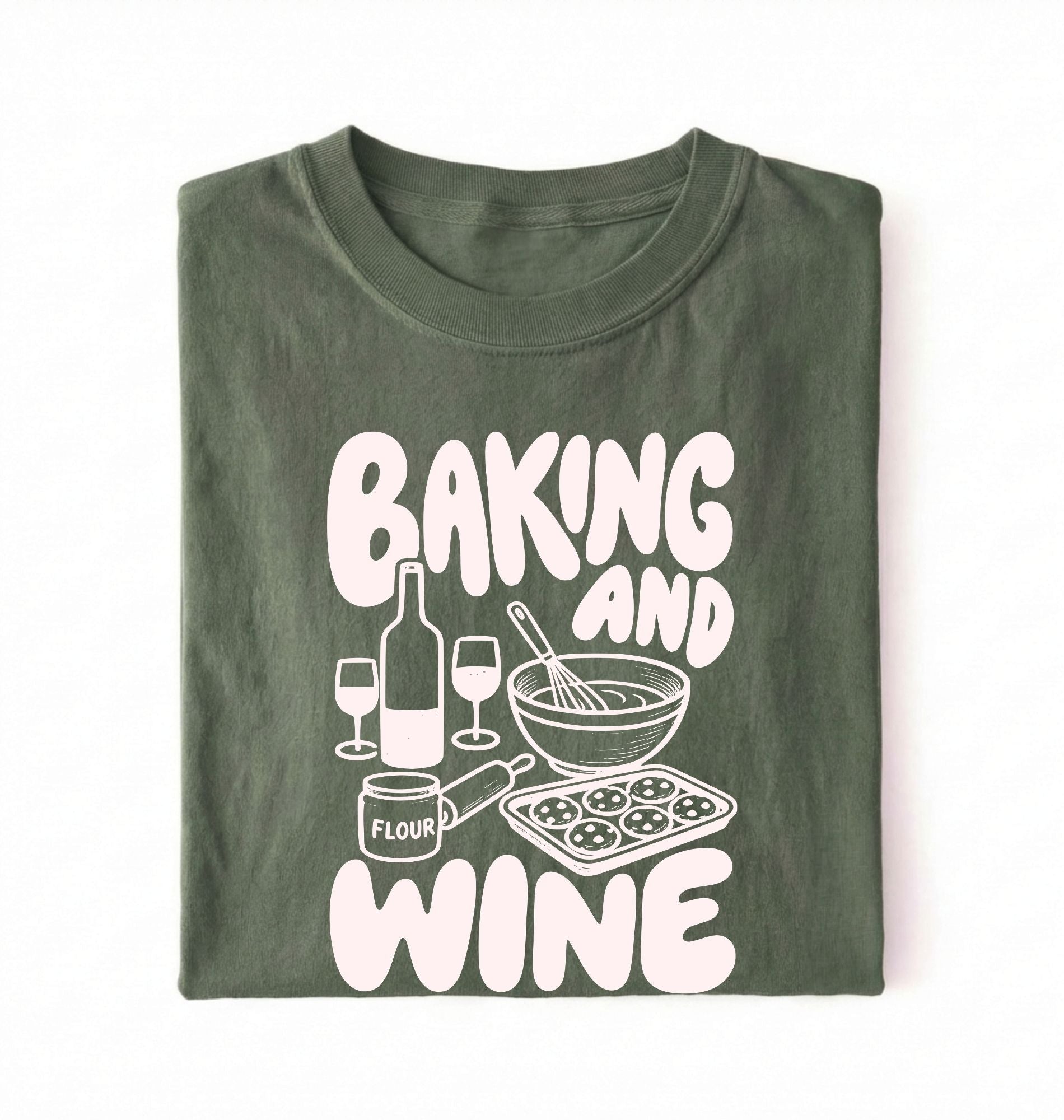 Flat lay of a green Baking and Wine graphic shirt for home bakers featuring baking tools and wine themed design on a white background