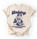 Flat lay of an ivory baking because murder is wrong shirt cream funny baking t shirt baker humor vintage style gift on a white background 