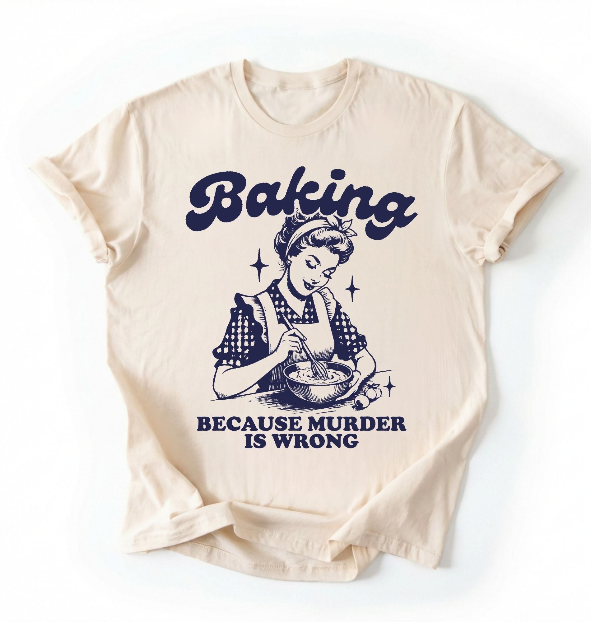 Flat lay of an ivory baking because murder is wrong shirt cream funny baking t shirt baker humor vintage style gift on a white background 