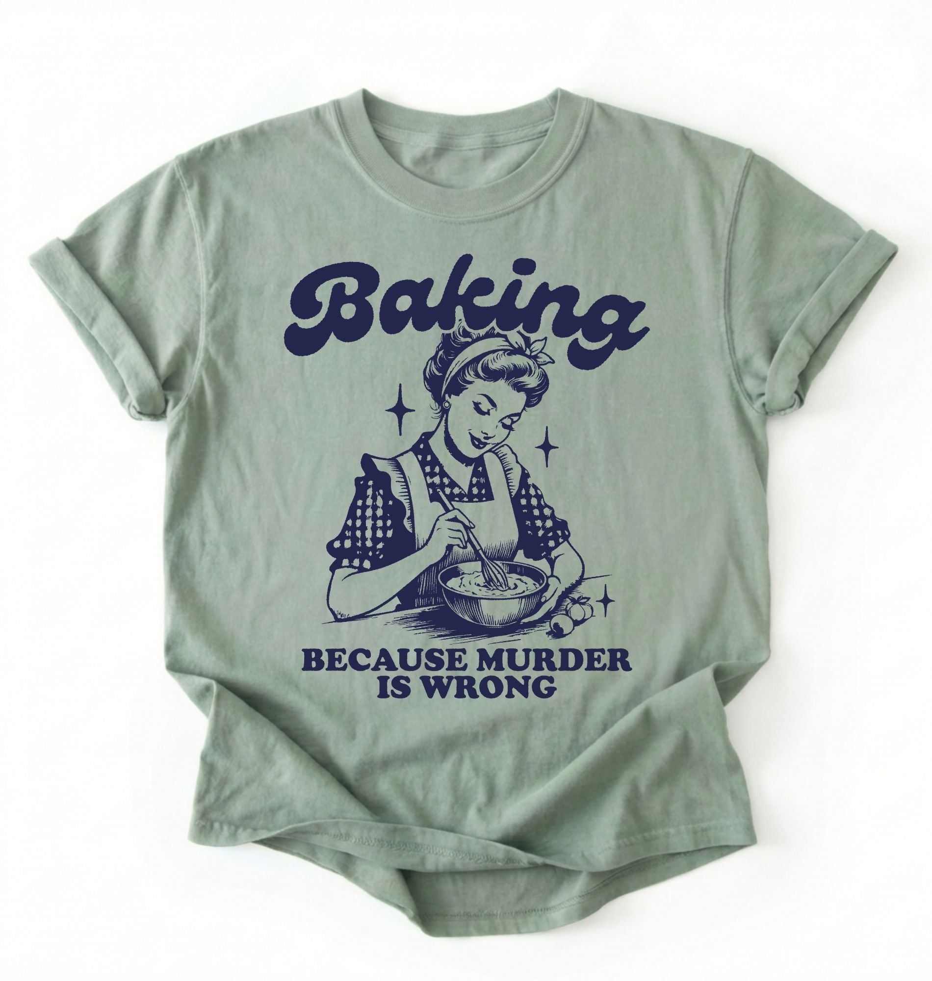 Flat lay of a Bay_Sage baking because murder is wrong shirt cream funny baking t shirt baker humor vintage style gift on a white background 