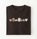 Flat lay of a brown baking ingredients shirt with flour butter sugar eggs vanilla and measuring cup baker gift on a white background 