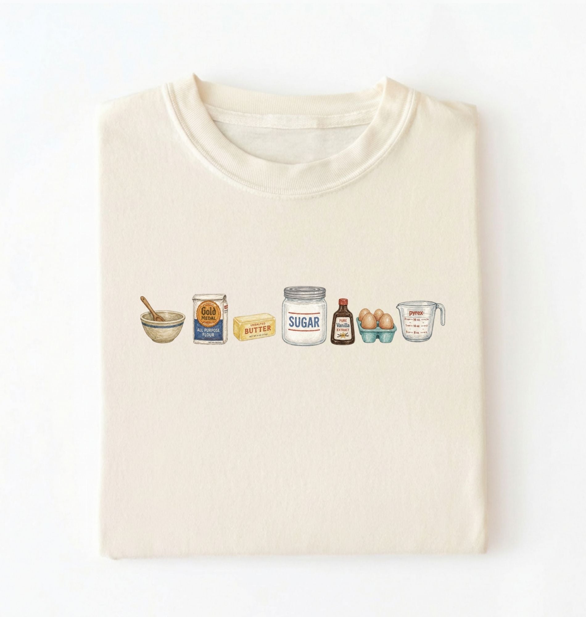 Flat lay of a cream baking ingredients shirt with flour butter sugar eggs vanilla and measuring cup baker gift on a white background 