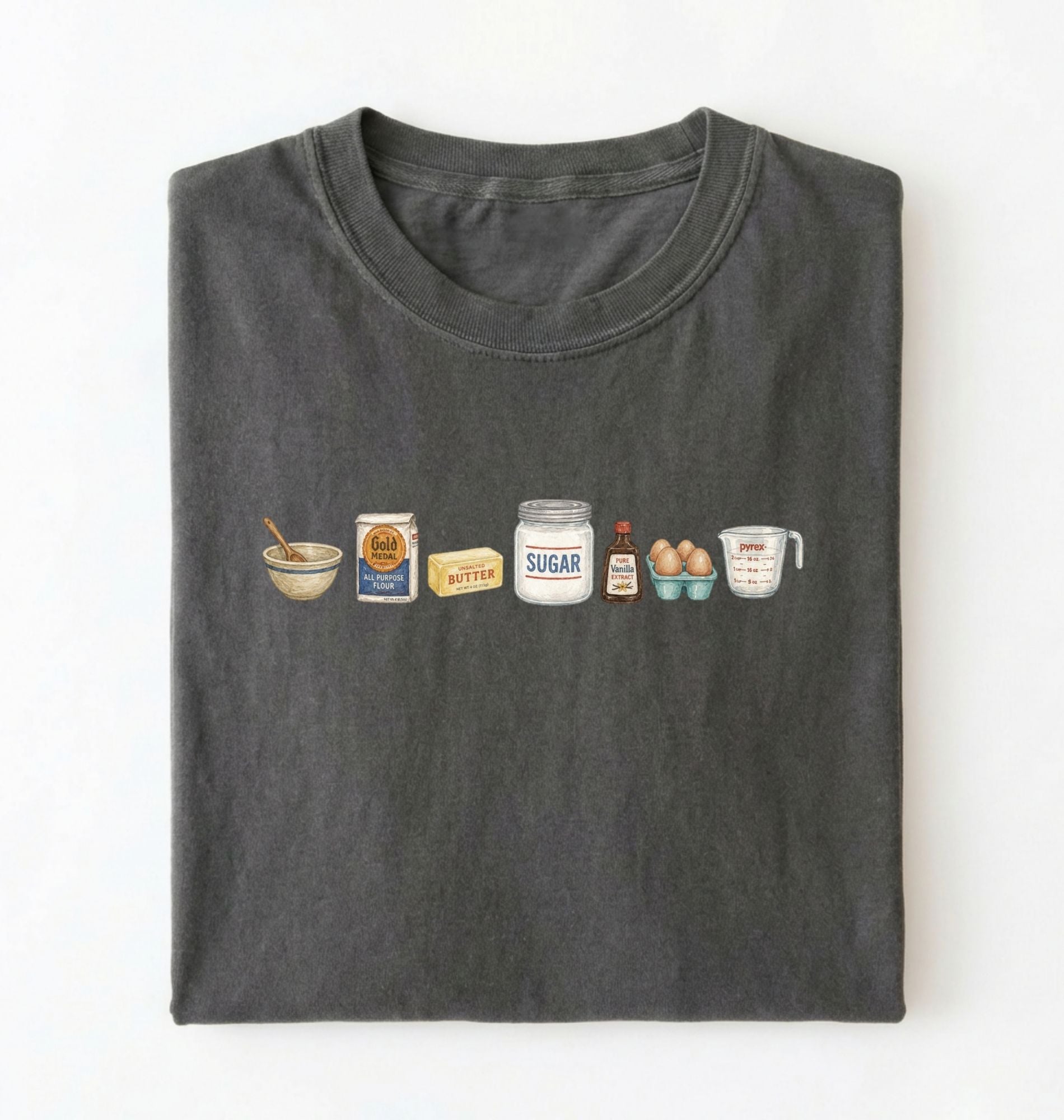 Flat lay of a charcoal baking ingredients shirt with flour butter sugar eggs vanilla and measuring cup baker gift on a white background 