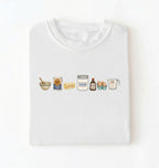 Flat lay of a white baking ingredients shirt with flour butter sugar eggs vanilla and measuring cup baker gift on a white background 