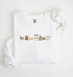 Flat lay of a white baking ingredients sweatshirt with flour butter sugar eggs vanilla and baking essentials design on a white background