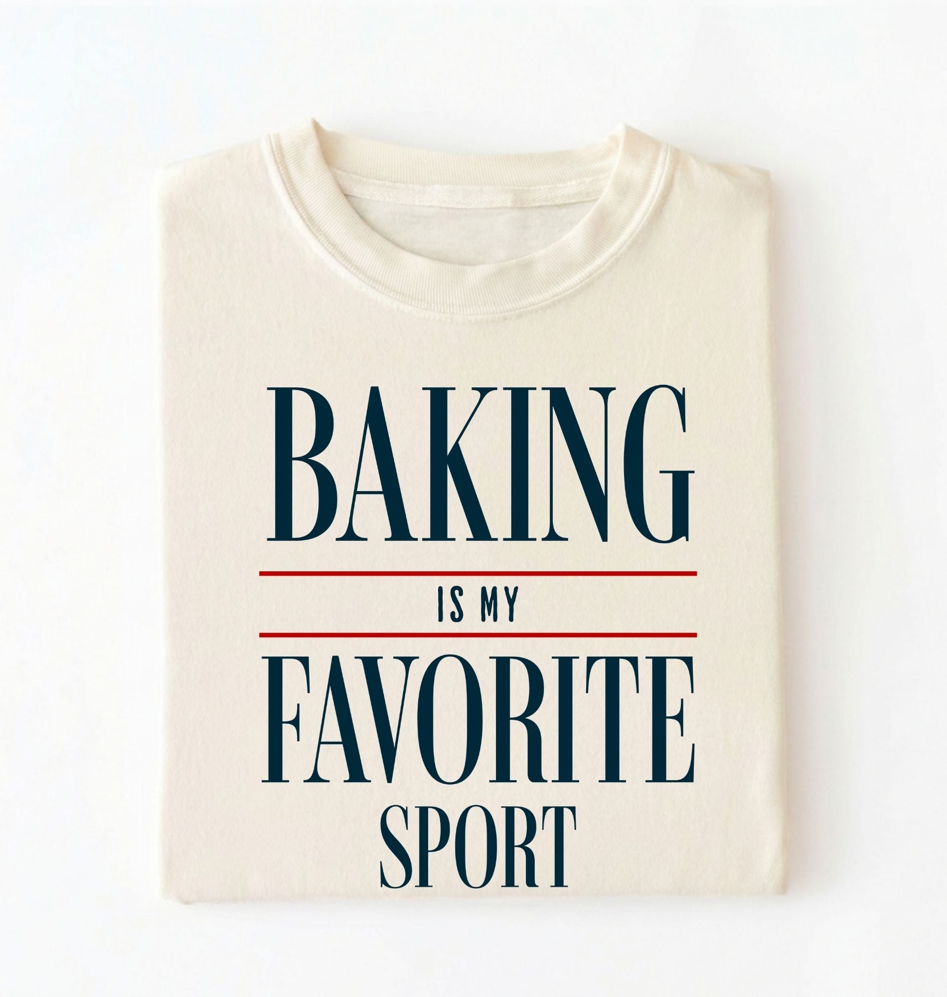 Flat lay of a ivory Baking Is My Favorite Sport graphic shirt for home bakers and baking enthusiasts on a white background 