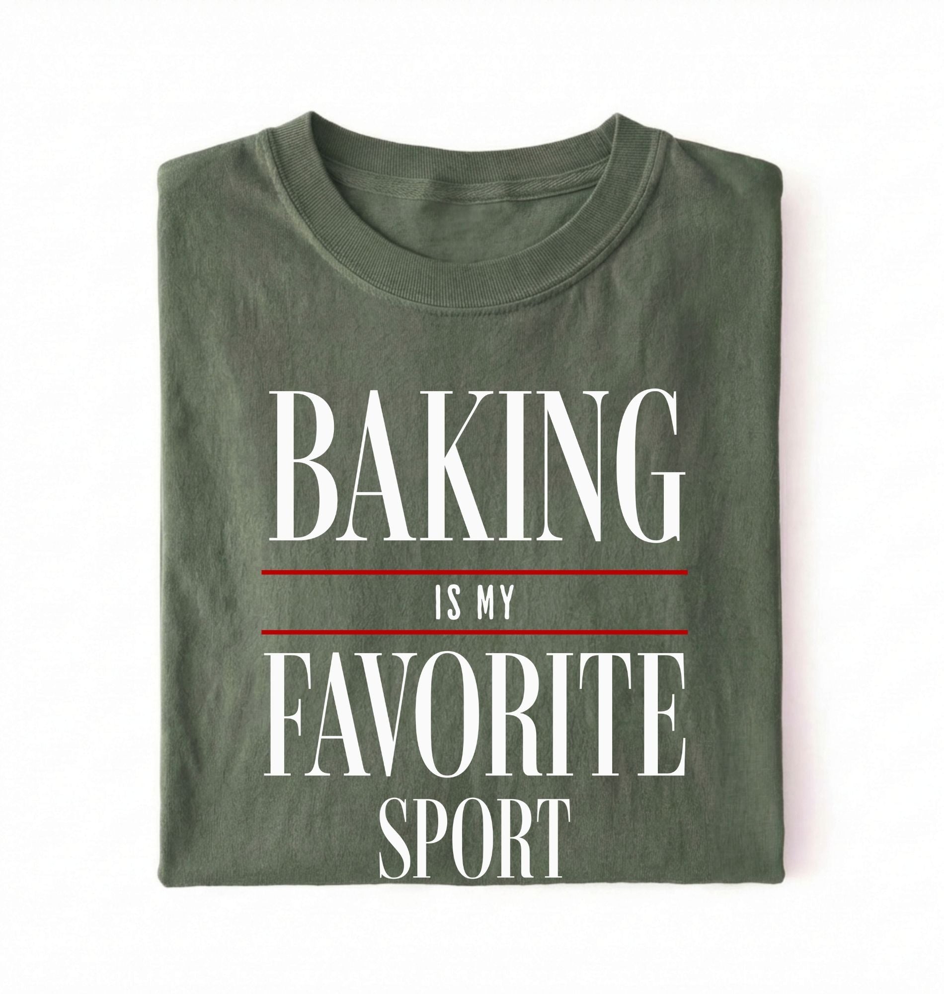 Flat lay of a green Baking Is My Favorite Sport graphic shirt for home bakers and baking enthusiasts on a white background 