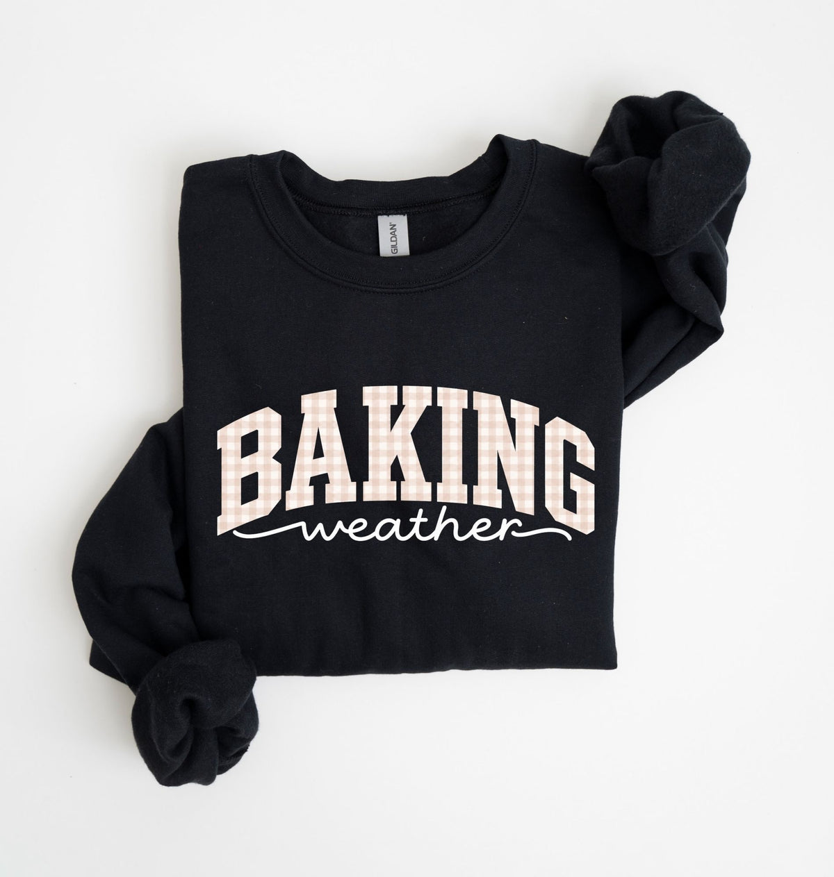 A black crewneck sweatshirt with 'BAKING weather' printed in white on the front, folded neatly on a white background.