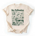 Flat lay of a ivory Military Green bee pollination shirt brown gardening t shirt beekeeper gift plant lover botanical science design on a white background 