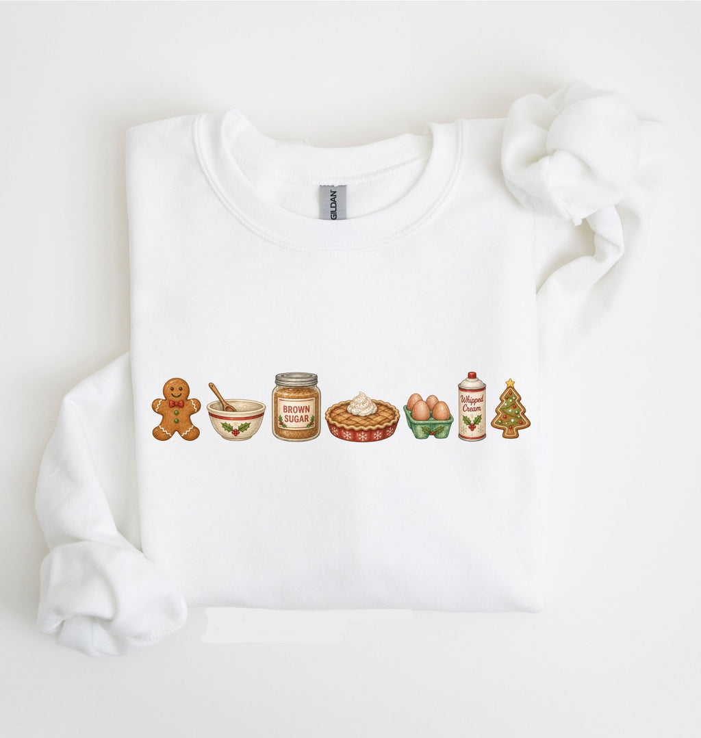 A white crewneck sweatshirt featuring a horizontal row of Christmas-themed gingerbread illustrations across the chest, displayed on a clean white background.