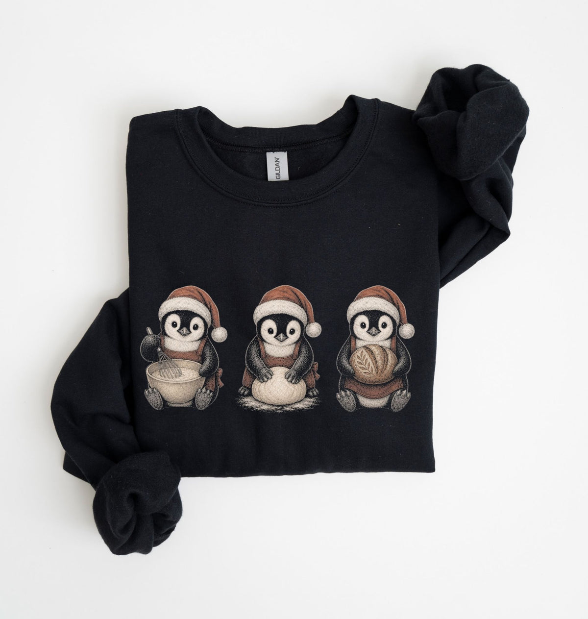 A black crewneck sweatshirt with 'BAKING weather' printed in white on the front, folded neatly on a white background.