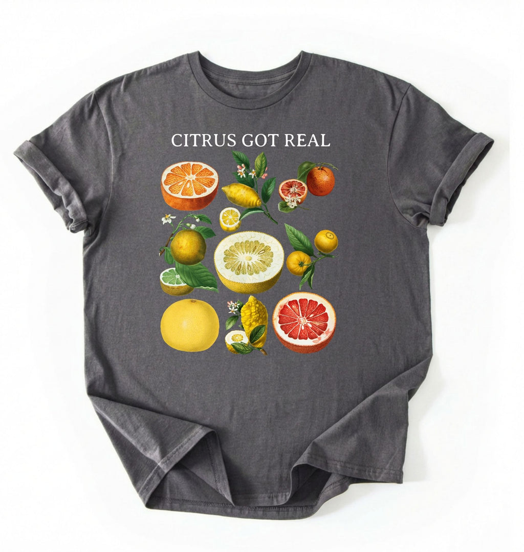 Flat lay white t shirt with the text White t-shirt with citrus fruit graphic and text 'Citrus Got Real' on a white background