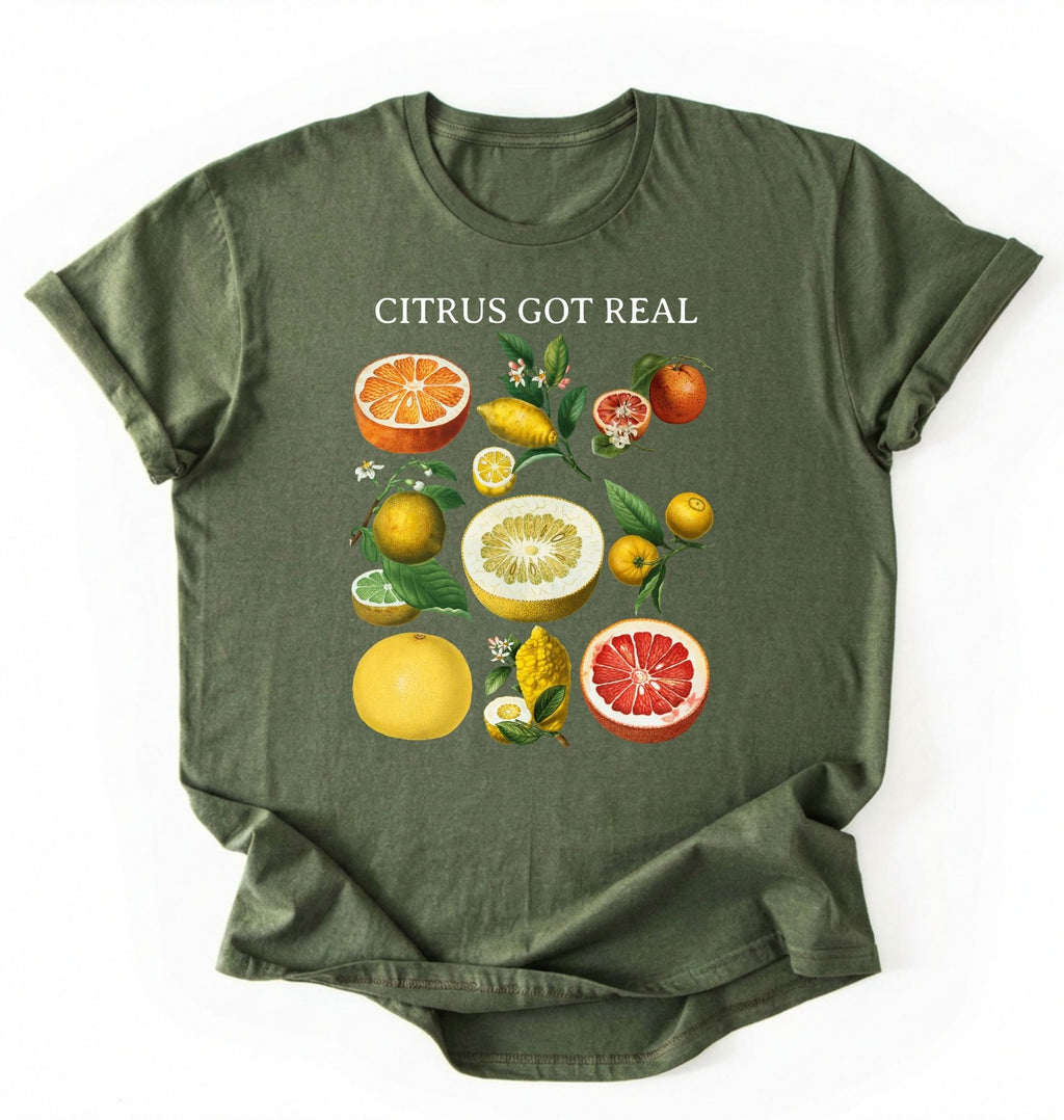 Flat lay Moss_Military_Green t shirt with the text White t-shirt with citrus fruit graphic and text 'Citrus Got Real' on a white background