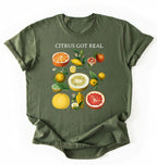 Flat lay Moss_Military_Green t shirt with the text White t-shirt with citrus fruit graphic and text 'Citrus Got Real' on a white background