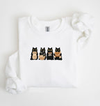 Flat lay of an white Cute black cat baker sweatshirt featuring baking cats with bread and mixing bowl crewneck on a white background 
