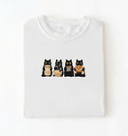 Flat lay of a Cute black cat baker shirt featuring baking cats with bread and mixing bowl on white t-shirt on a white background 
