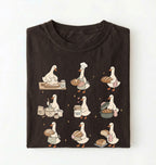 Flat lay of a Cute goose baker shirt with sourdough bread and cottagecore baking artwork on brown tee on a white background 