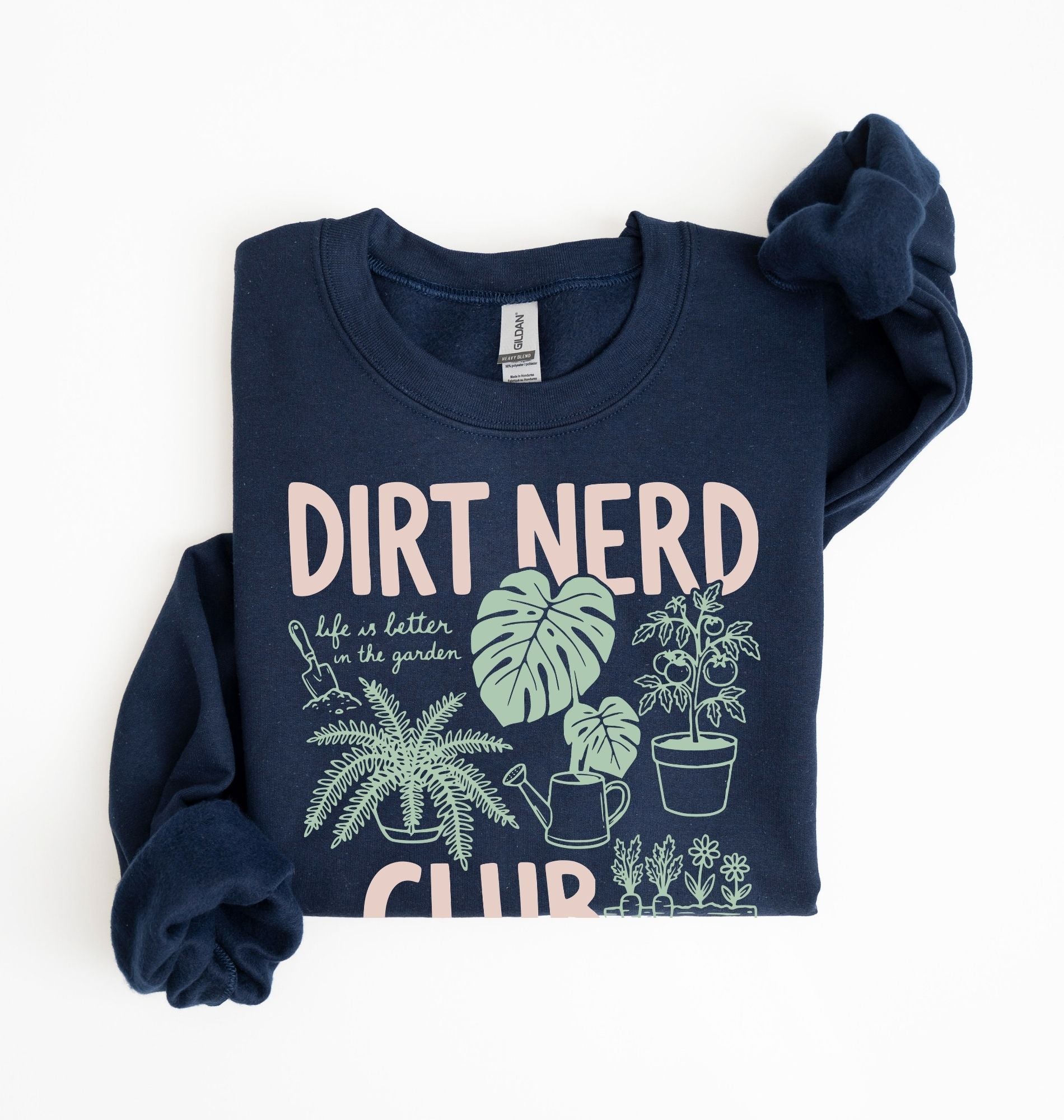Flat lay of a navy blue Dirt nerd club sweatshirt with plant illustrations perfect gift for gardeners plant lovers and nature enthusiasts on a white background