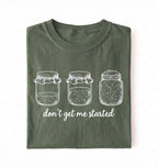 Flat lay of a moss Funny sourdough shirt with starter jars illustration perfect gift for bakers and fermentation lovers on a white background