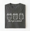 Flat lay of a pepper Funny sourdough shirt with starter jars illustration perfect gift for bakers and fermentation lovers on a white background
