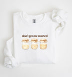 Flat lay of a white Cottagecore kitchen sweatshirt with jars illustration cozy baking lover gift on a white background 