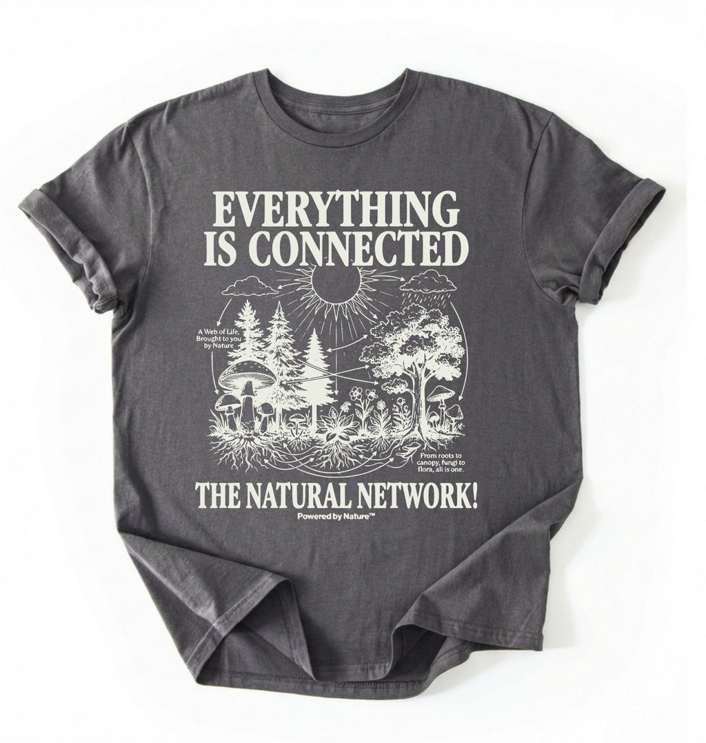 Flat lay of a Charcoal t-shirt featuring a forest and fungi illustration with text reading “Everything Is Connected The Natural Network.” perfect gift for nature lovers and eco friendly lifestyle on a white background 