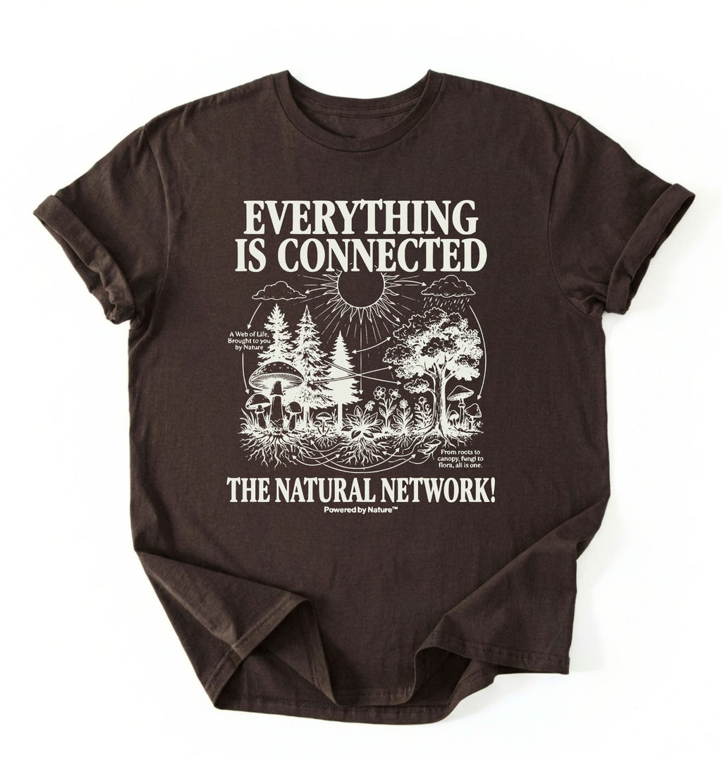 Flat lay of a Espresso_Darkchocolate t-shirt featuring a forest and fungi illustration with text reading “Everything Is Connected The Natural Network.” perfect gift for nature lovers and eco friendly lifestyle on a white background 