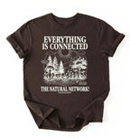 Flat lay of a Espresso_Darkchocolate t-shirt featuring a forest and fungi illustration with text reading “Everything Is Connected The Natural Network.” perfect gift for nature lovers and eco friendly lifestyle on a white background 